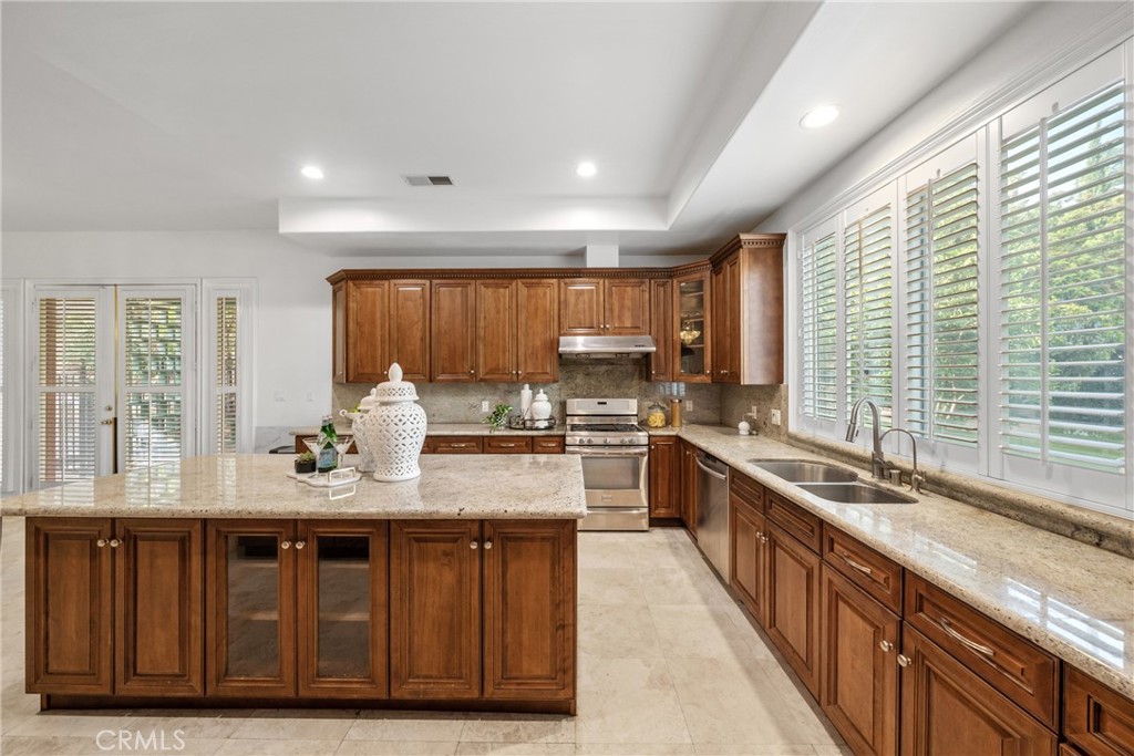19910 Tennessee Trail Walnut, CA 91789 - Photo 33 of 70 a large kitchen with kitchen island granite countertop a large window and stainless steel appliances