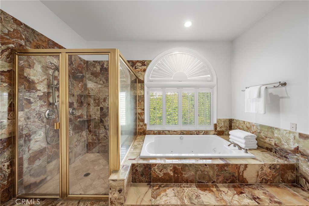 19910 Tennessee Trail Walnut, CA 91789 - Photo 42 of 70 a spacious bedroom with a bed and a window