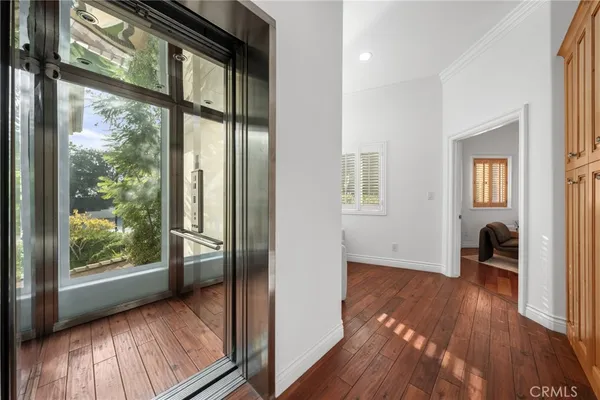 a view of a porch with wooden floor and stairs