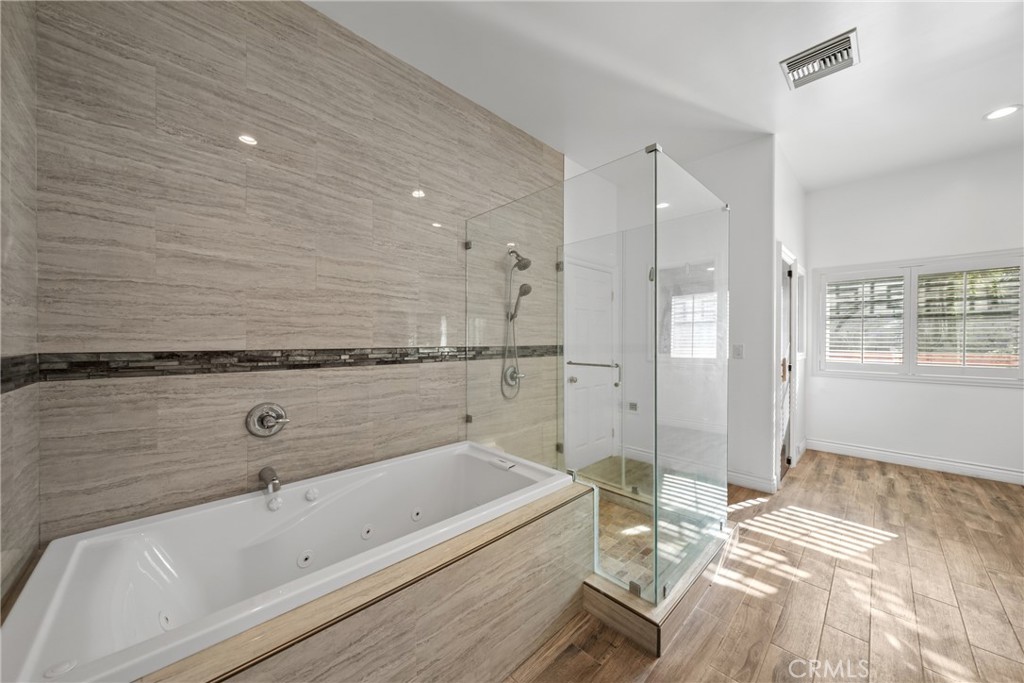 19910 Tennessee Trail Walnut, CA 91789 - Photo 48 of 70 a bathroom with a bathtub and a shower