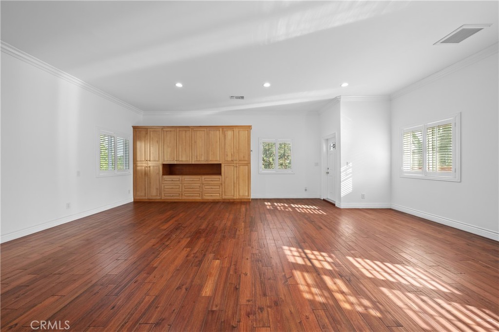 19910 Tennessee Trail Walnut, CA 91789 - Photo 50 of 70 an empty room with wooden floor and windows
