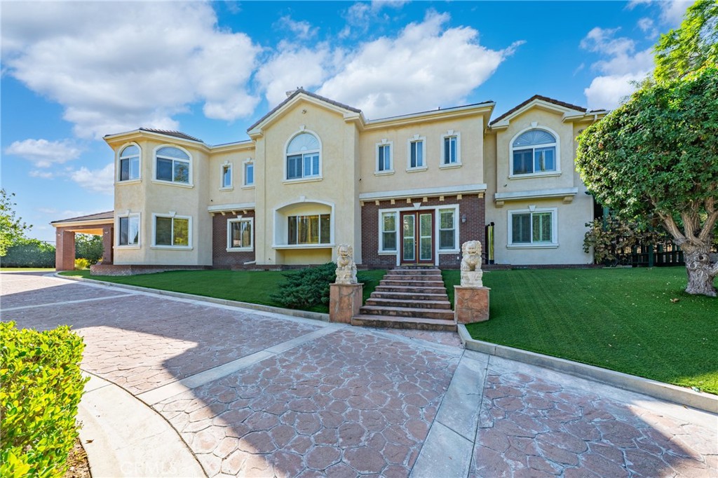 19910 Tennessee Trail Walnut, CA 91789 - Photo 5 of 70 a front view of a house with a garden