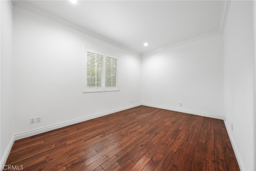 19910 Tennessee Trail Walnut, CA 91789 - Photo 52 of 70 an empty room with wooden floor and windows