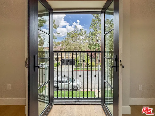 a kitchen with a refrigerator a sink and dishwasher a oven with wooden floor