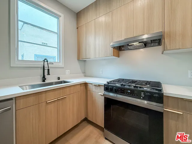 a view of a kitchen with a sink