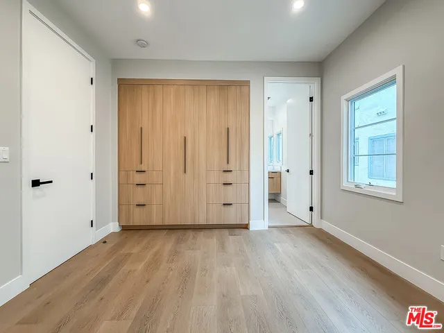 an empty room with a empty space and a window