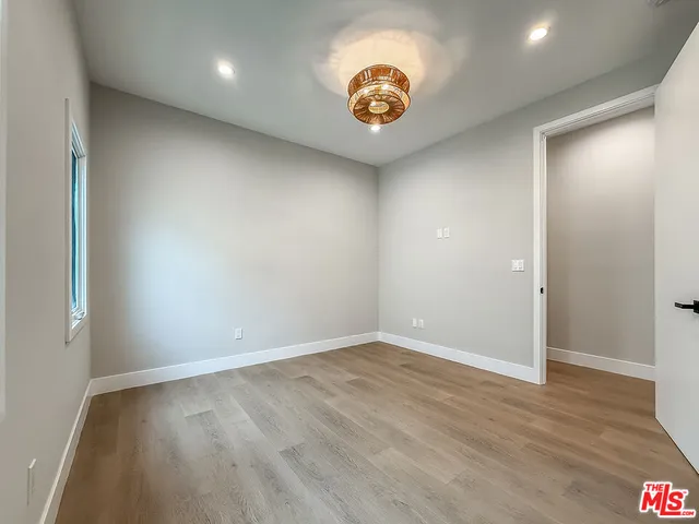a bathroom with a double vanity sink toilet and shower