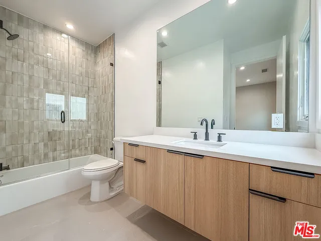 a kitchen with a sink and a large window