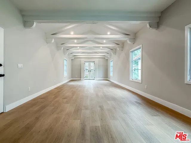 a large parking space with flat screen tv