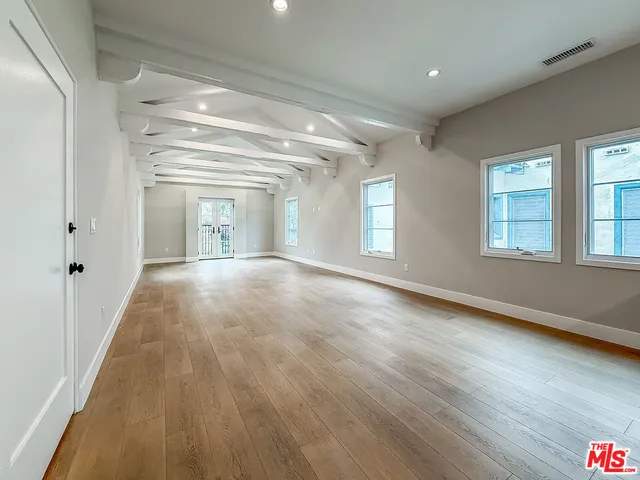 a view of a dining room with furniture and a livingroom