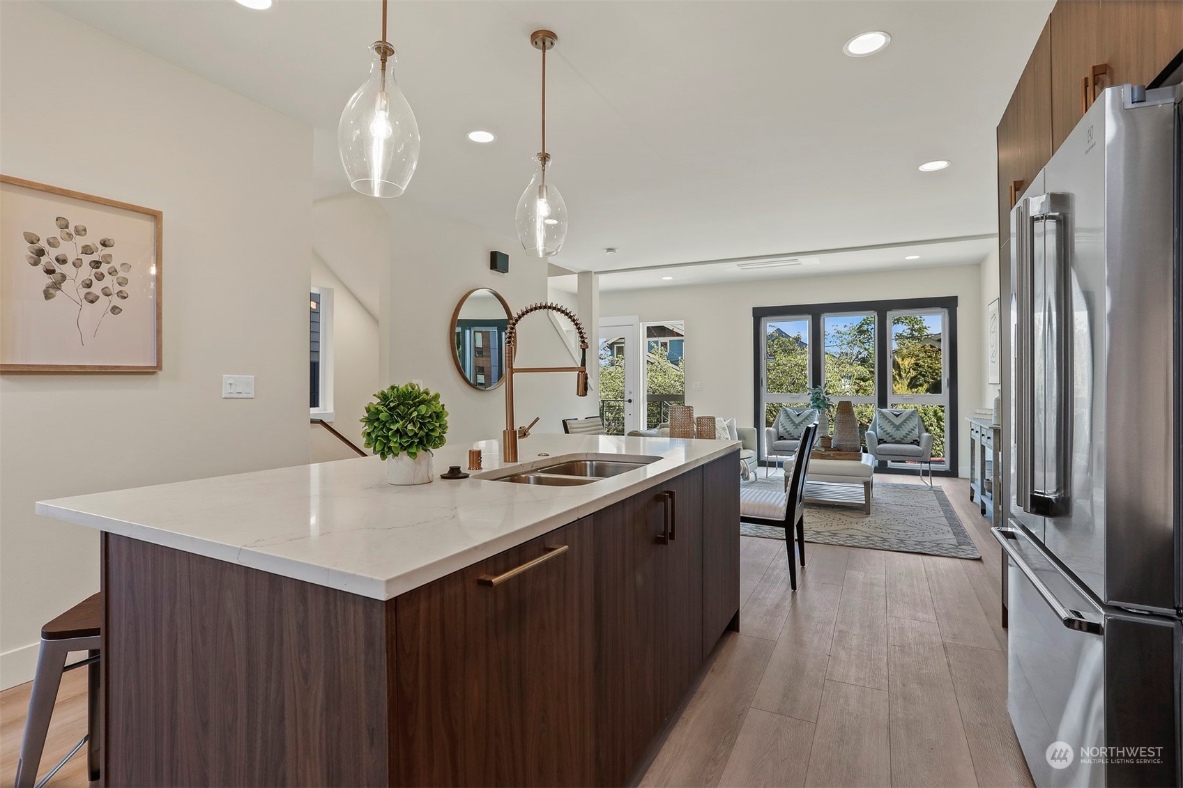 520 North 48th Street, Unit B Seattle, WA 98103 - Photo 11 of 38 a kitchen with stainless steel appliances a sink stove and wooden floor