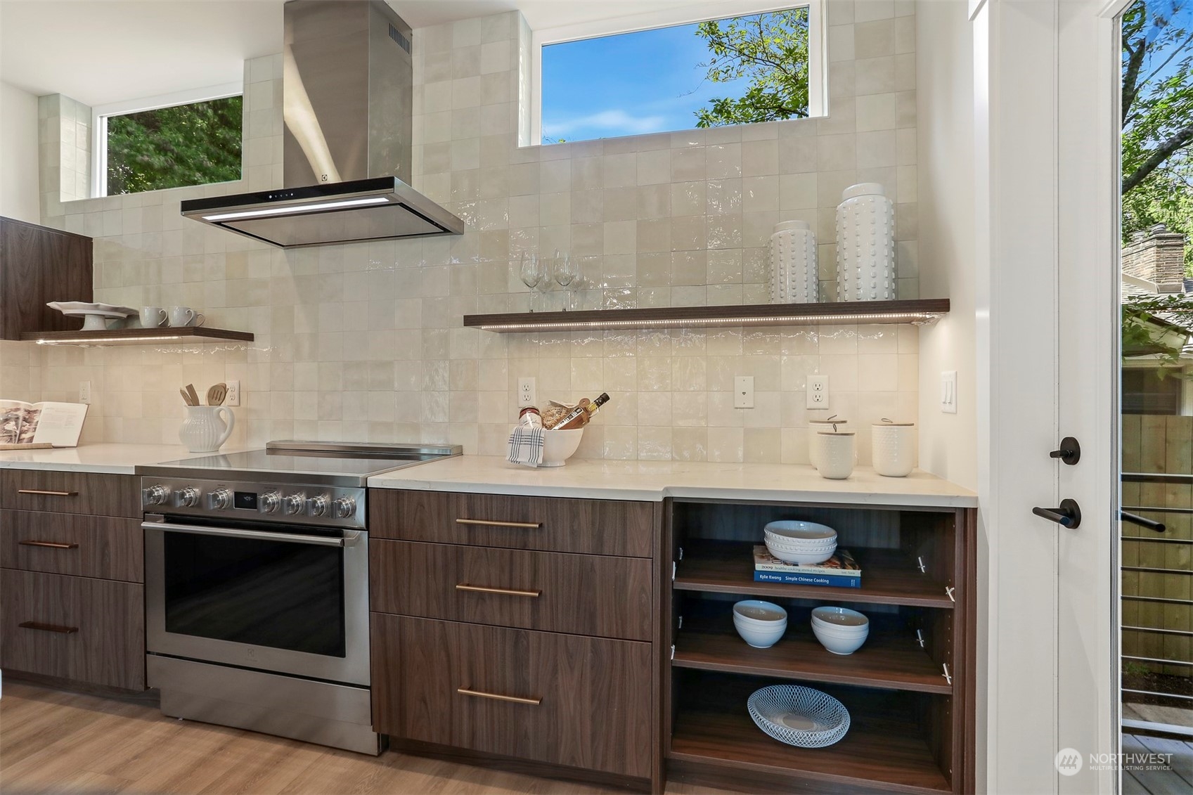 520 North 48th Street, Unit B Seattle, WA 98103 - Photo 12 of 38 a kitchen with stainless steel appliances granite countertop a stove and a microwave