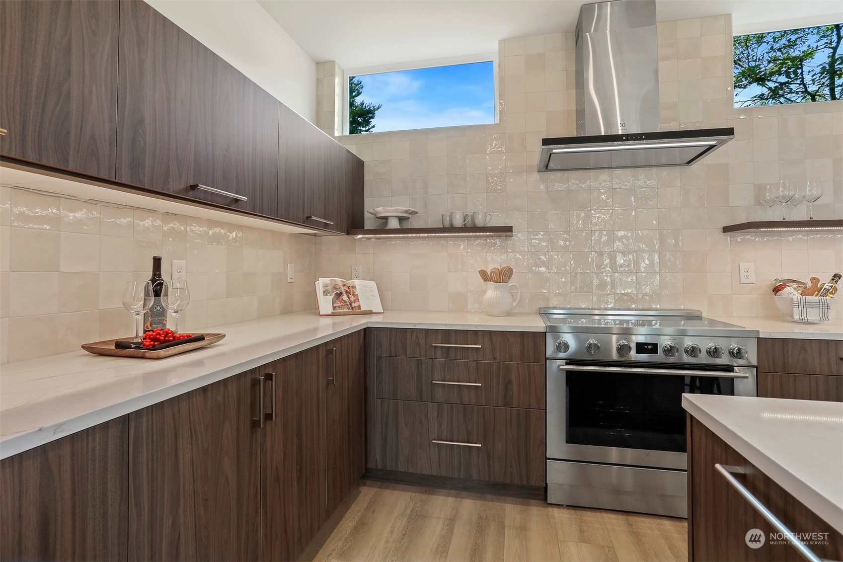 520 North 48th Street, Unit B Seattle, WA 98103 - Photo 13 of 38 a kitchen with stainless steel appliances a sink and cabinets