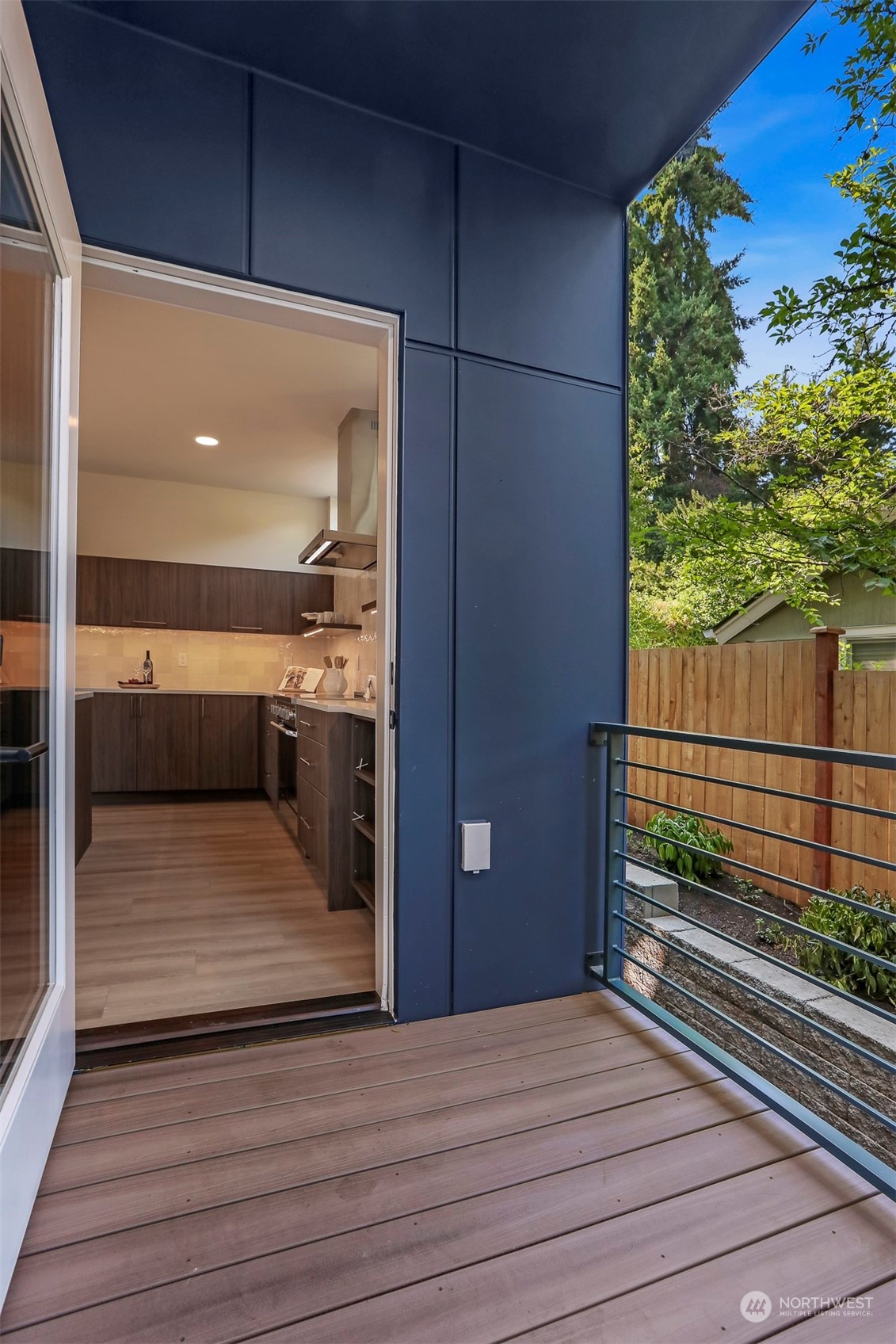 520 North 48th Street, Unit B Seattle, WA 98103 - Photo 14 of 38 a view of a balcony with wooden floor and iron fence