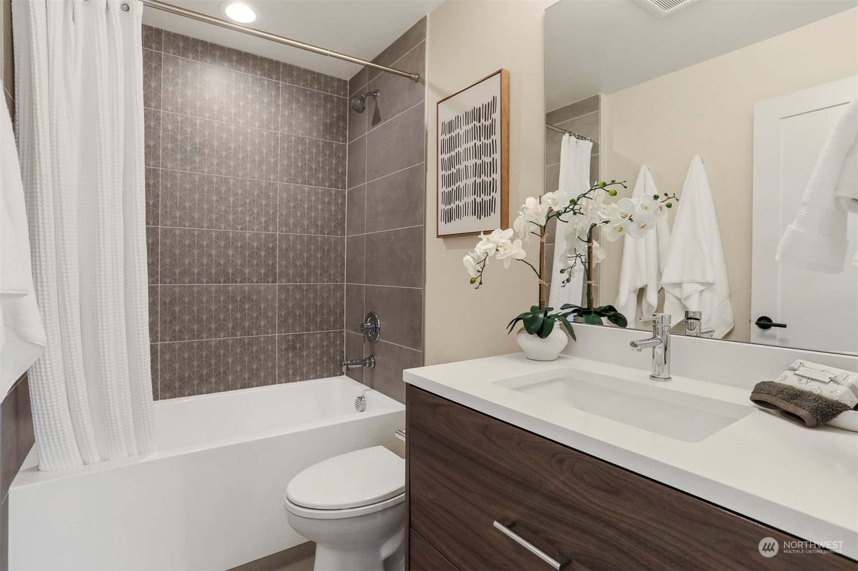 520 North 48th Street, Unit B Seattle, WA 98103 - Photo 19 of 38 a bathroom with a sink a toilet and a bathtub