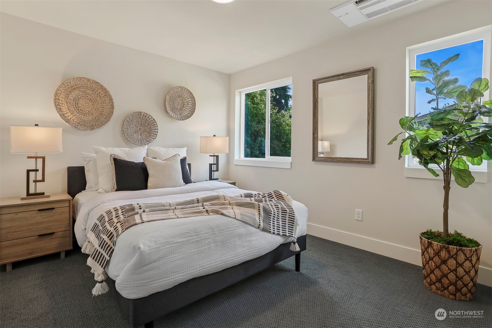 520 North 48th Street, Unit B Seattle, WA 98103 - Photo 21 of 38 a bedroom with bed and a potted plant