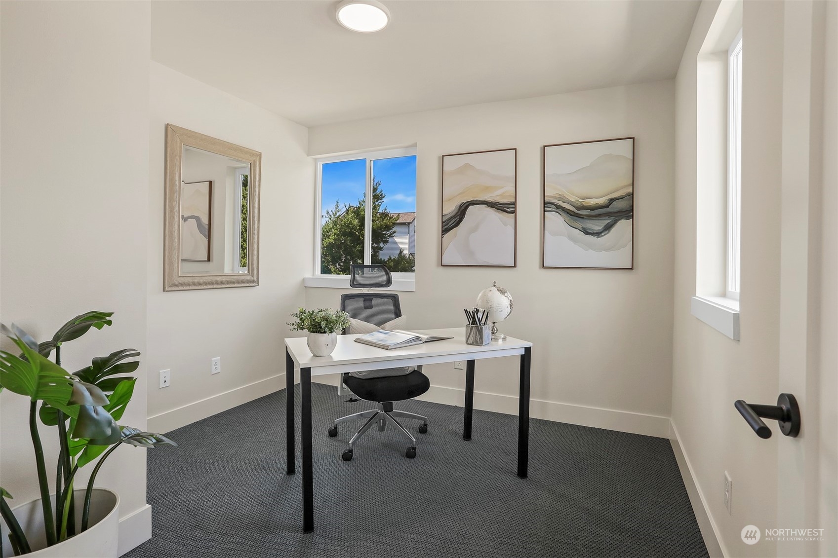 520 North 48th Street, Unit B Seattle, WA 98103 - Photo 23 of 38 a view of a workspace room with wooden floor and chair