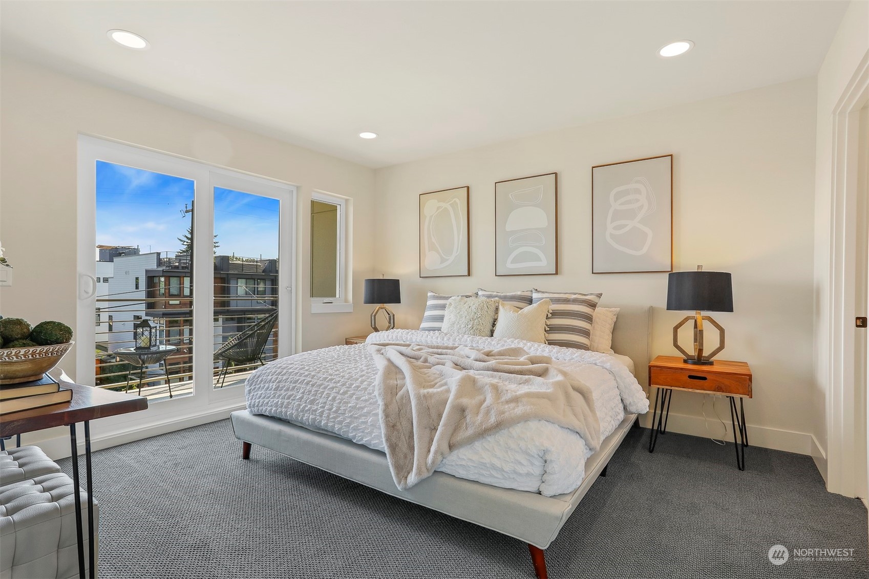 520 North 48th Street, Unit B Seattle, WA 98103 - Photo 24 of 38 a spacious bedroom with a bed and glass door