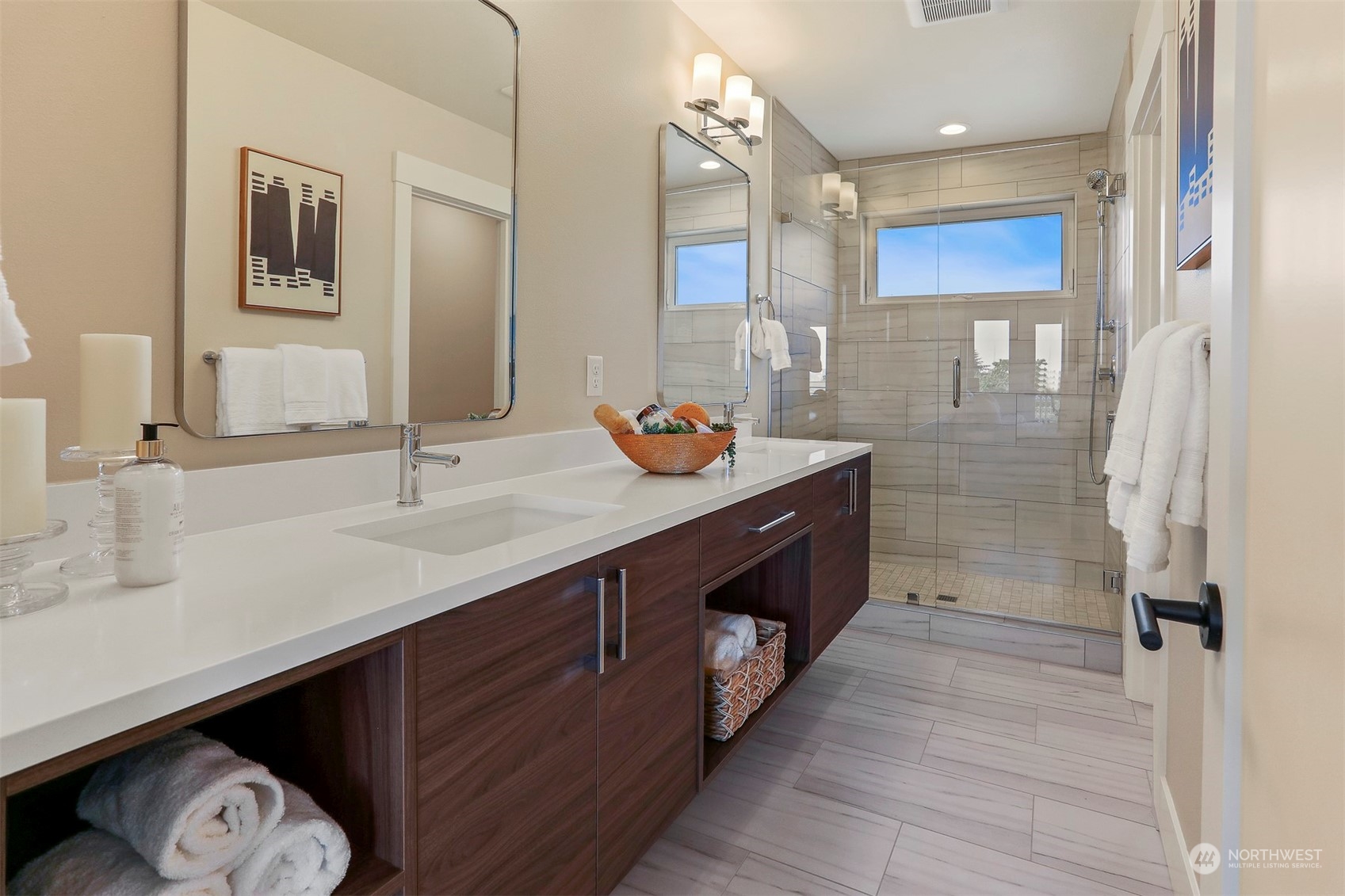 520 North 48th Street, Unit B Seattle, WA 98103 - Photo 28 of 38 a bathroom with a sink double vanity and a shower