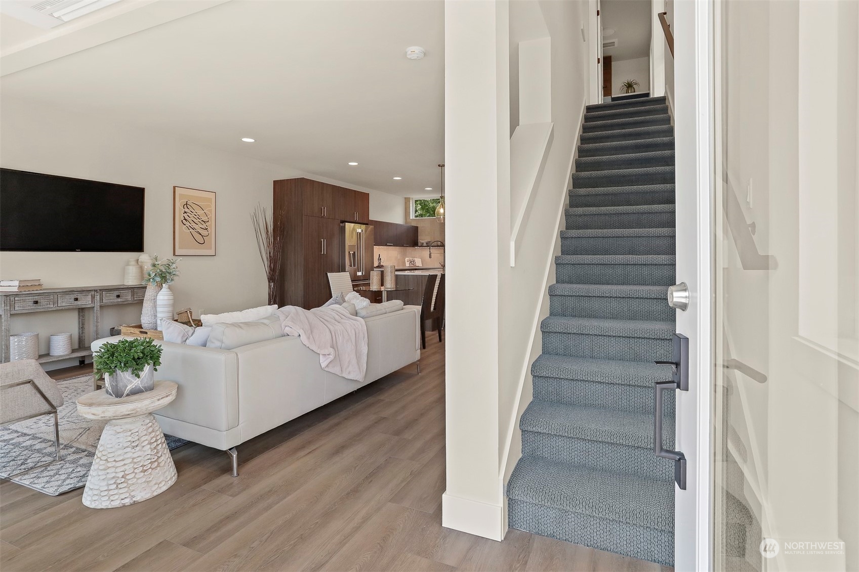 520 North 48th Street, Unit B Seattle, WA 98103 - Photo 3 of 38 a living room with furniture a fireplace and a flat screen tv