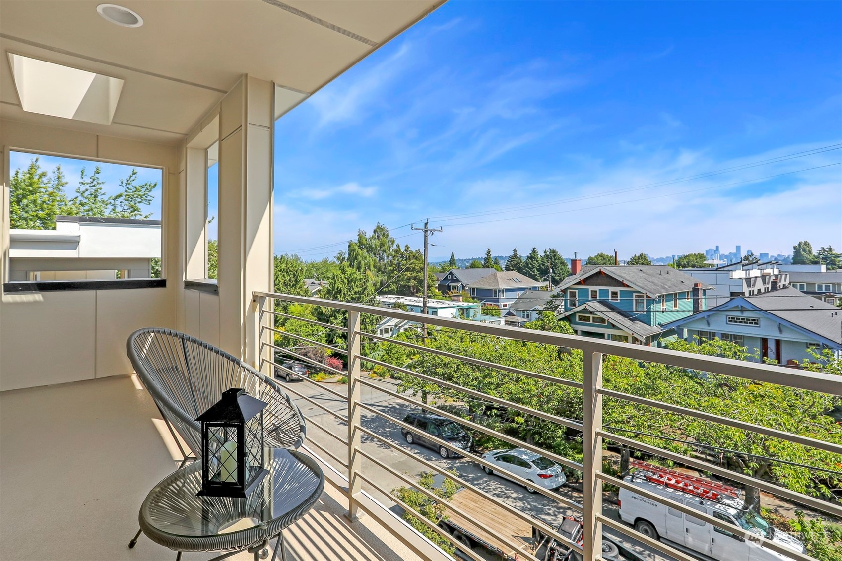 520 North 48th Street, Unit B Seattle, WA 98103 - Photo 32 of 38 a view of a balcony with two chairs and a table