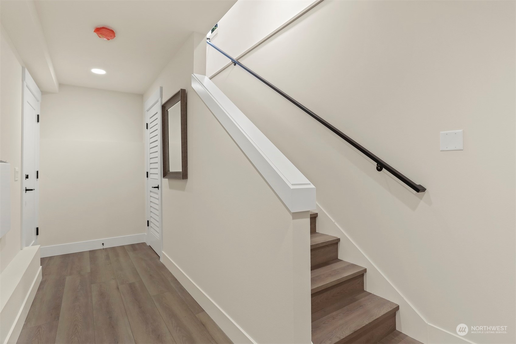 520 North 48th Street, Unit B Seattle, WA 98103 - Photo 34 of 38 a view of entryway and hall with wooden floor
