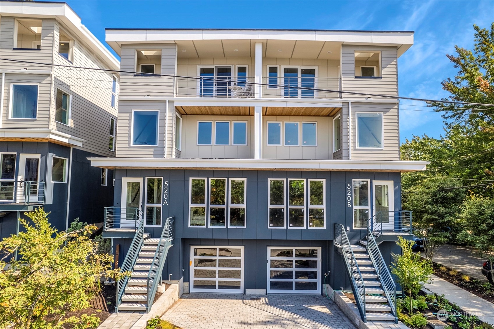 520 North 48th Street, Unit B Seattle, WA 98103 - Photo 37 of 38 a front view of a residential apartment building with a yard