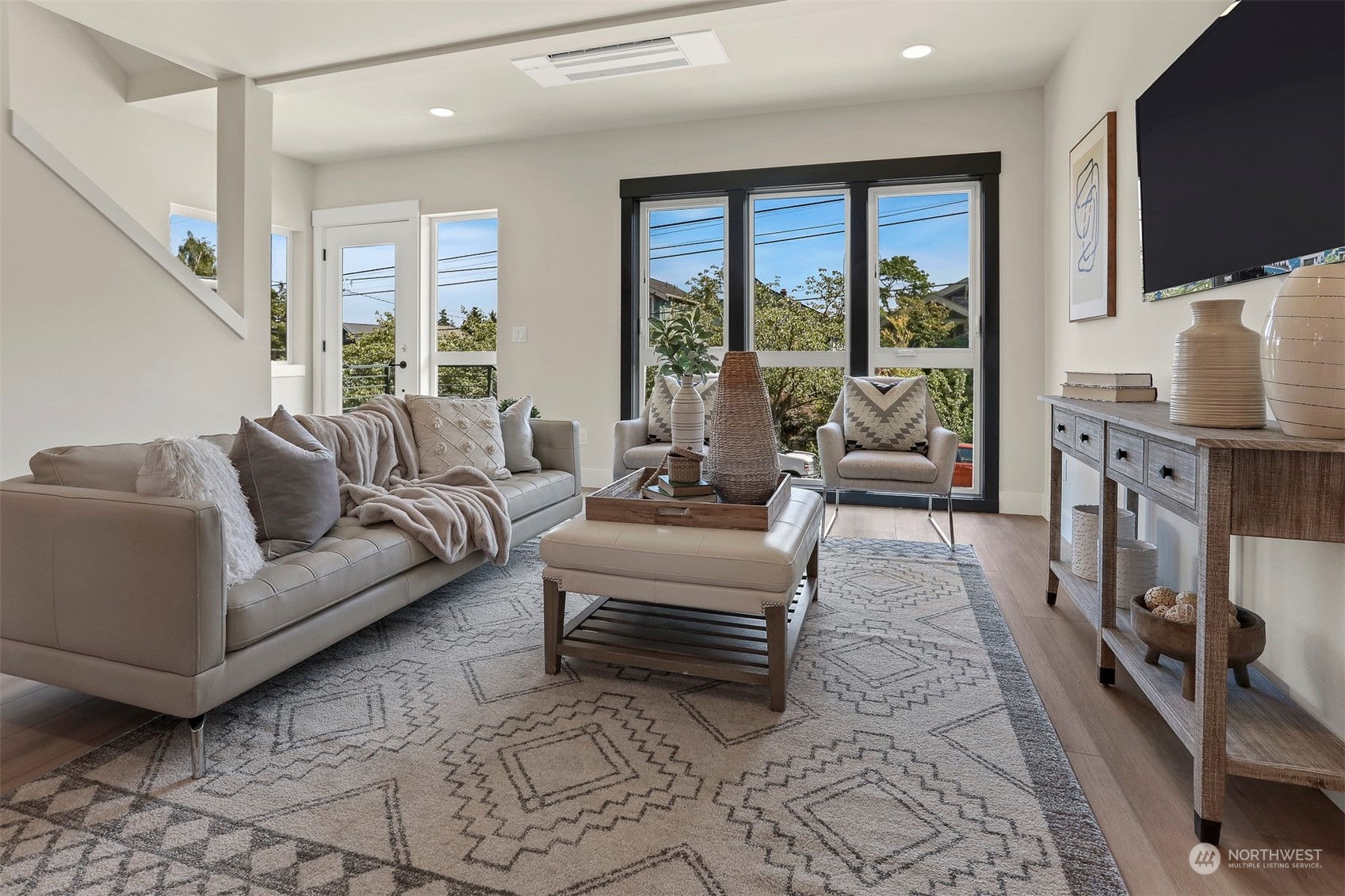520 North 48th Street, Unit B Seattle, WA 98103 - Photo 4 of 38 a living room with furniture large window and a flat screen tv