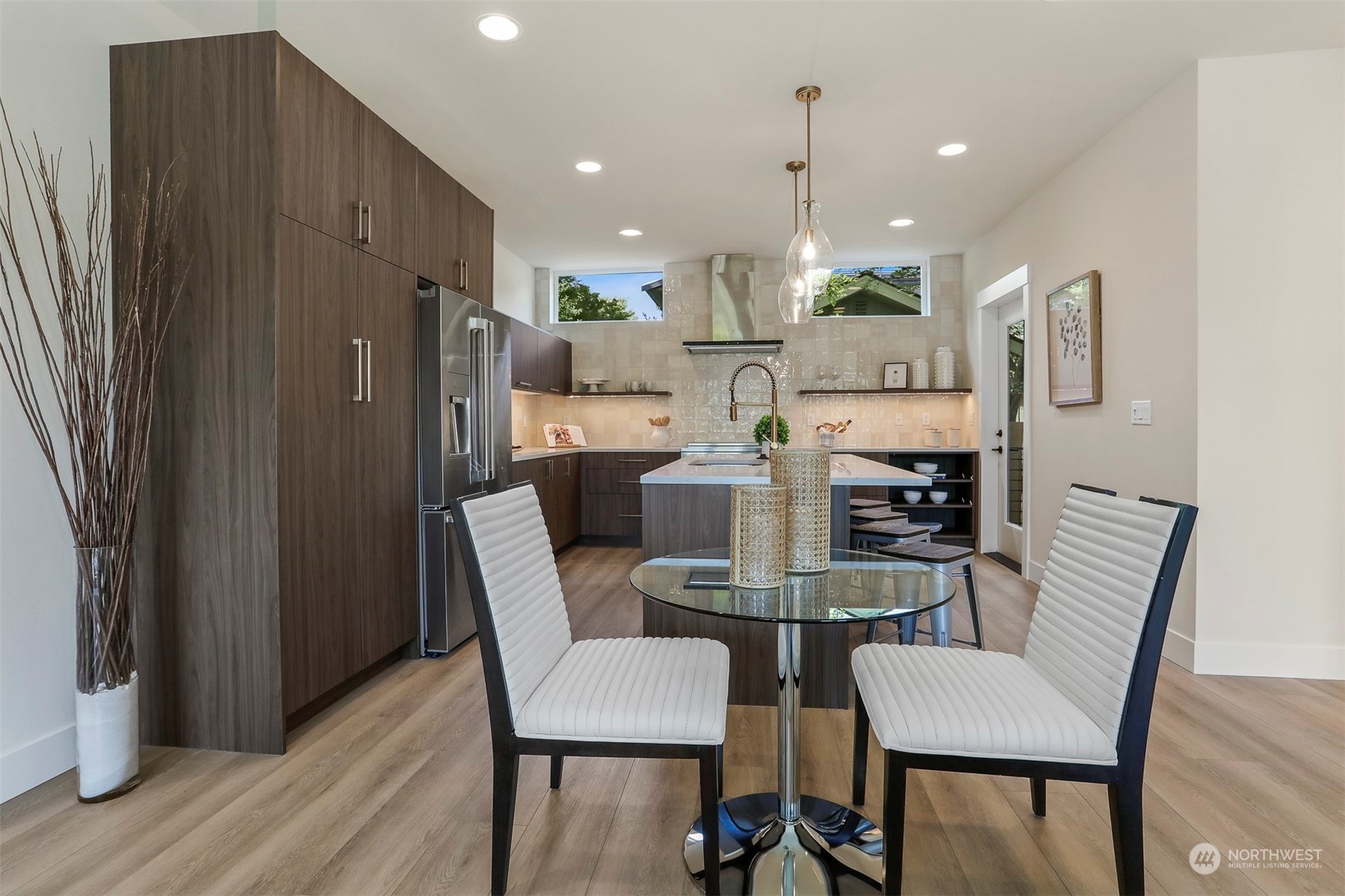 520 North 48th Street, Unit B Seattle, WA 98103 - Photo 10 of 38 a dining room with furniture and a chandelier