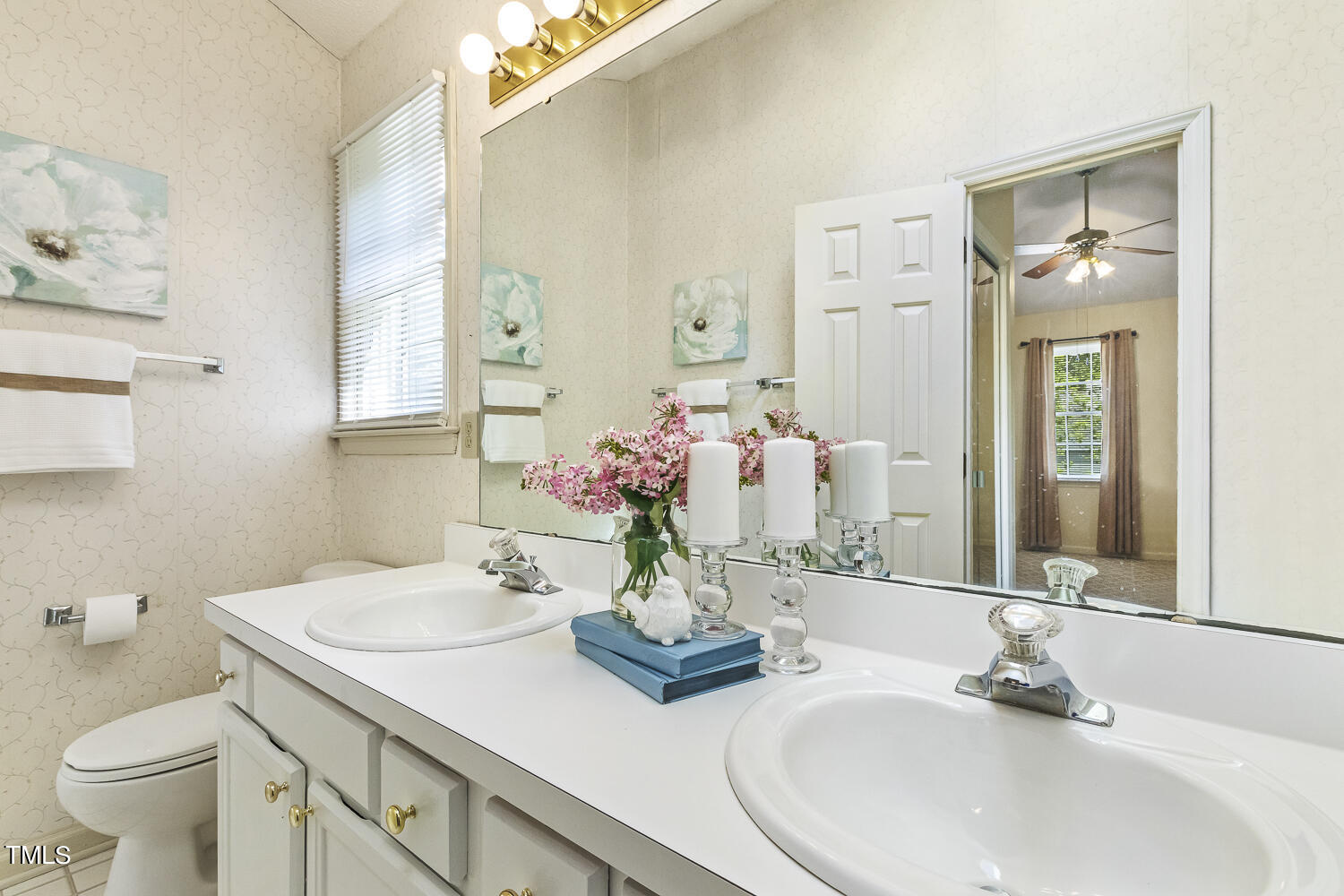 4700 Knightsbridge Way Raleigh, NC 27604 - Photo 7 of 11 a bathroom with a sink a toilet and mirror
