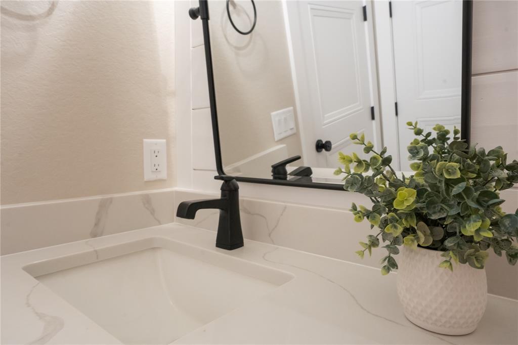 440 Palma Ceia Road Winter Haven, FL 33884 - Photo 47 of 78 a white bath tub sitting in a bathroom
