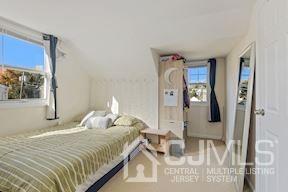 39 Morningside Road Colonia, NJ 07067 - Photo 15 of 30 a bedroom with a bed and a mirror