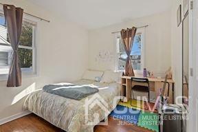 39 Morningside Road Colonia, NJ 07067 - Photo 22 of 30 a bedroom with a bed and a mirror