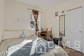 39 Morningside Road Colonia, NJ 07067 - Photo 23 of 30 a bedroom with a bed and a table