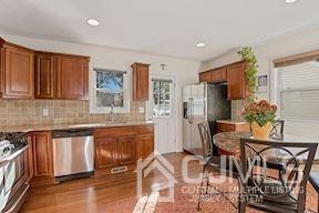 39 Morningside Road Colonia, NJ 07067 - Photo 27 of 30 a kitchen with granite countertop sink cabinets and stainless steel appliances