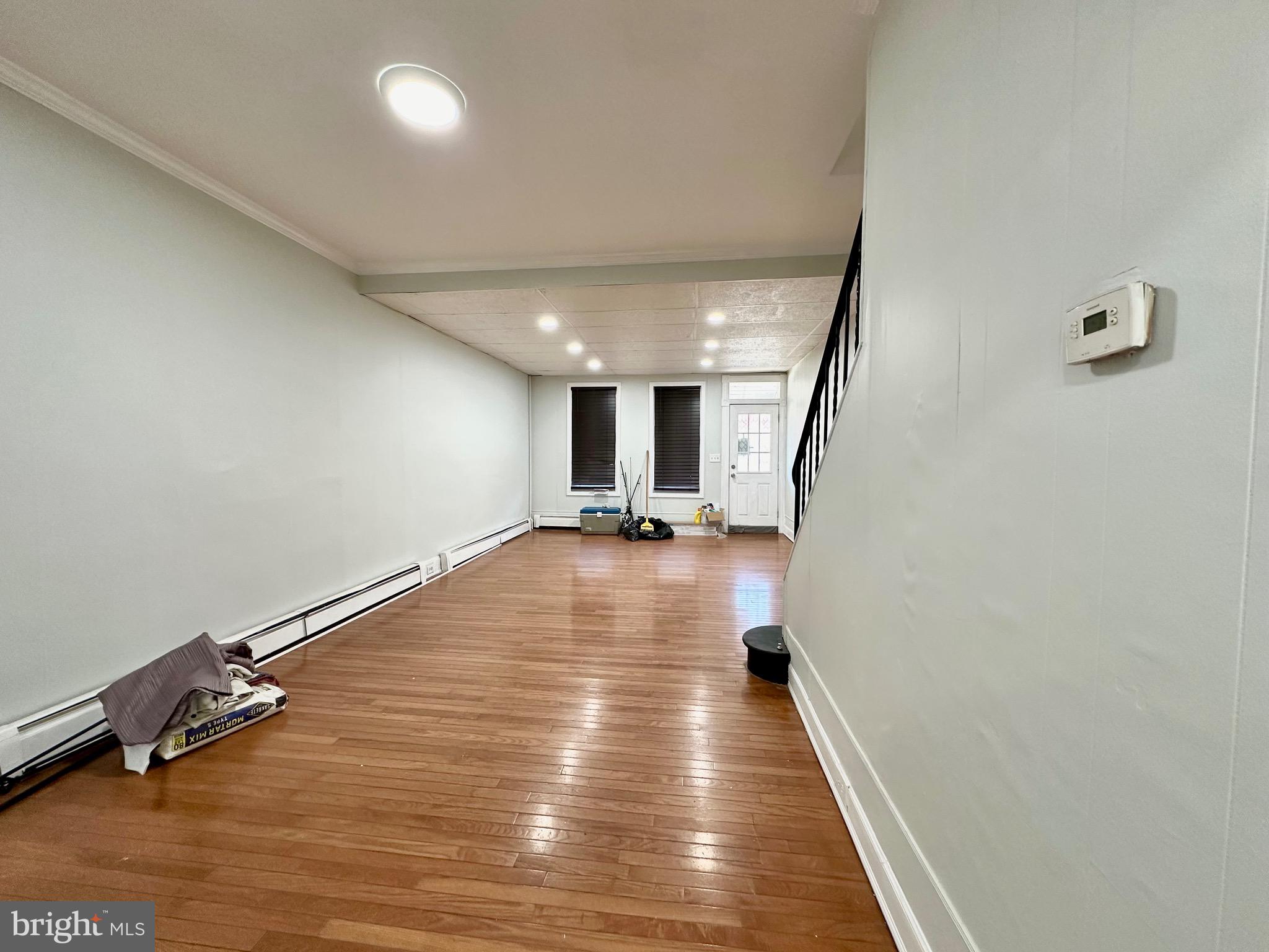 23 Lily Street Hamilton, NJ 08610 - Photo 9 of 10 a view of a room with wooden floor and stairs