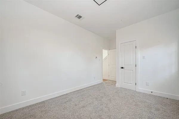 a bathroom with a toilet sink a mirror and vanity