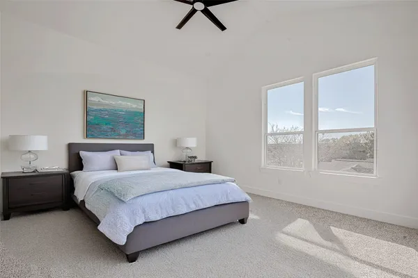a bathroom with double vanity sink a mirror and shower