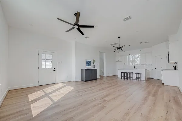 a view of a kitchen with a sink and a window
