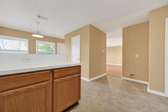 a view of cabinets and window