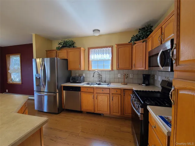 a view of a room with window and chandelier