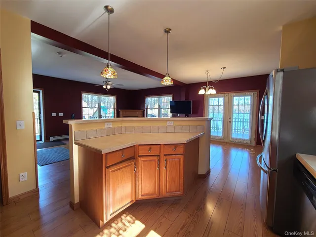 a large kitchen with stainless steel appliances lots of counter space