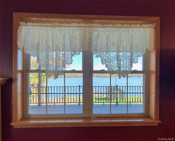 a living room with furniture and a walk in closet