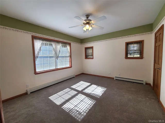 a view of a patio with wooden floor