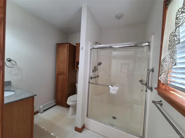 a view of a balcony with wooden floor