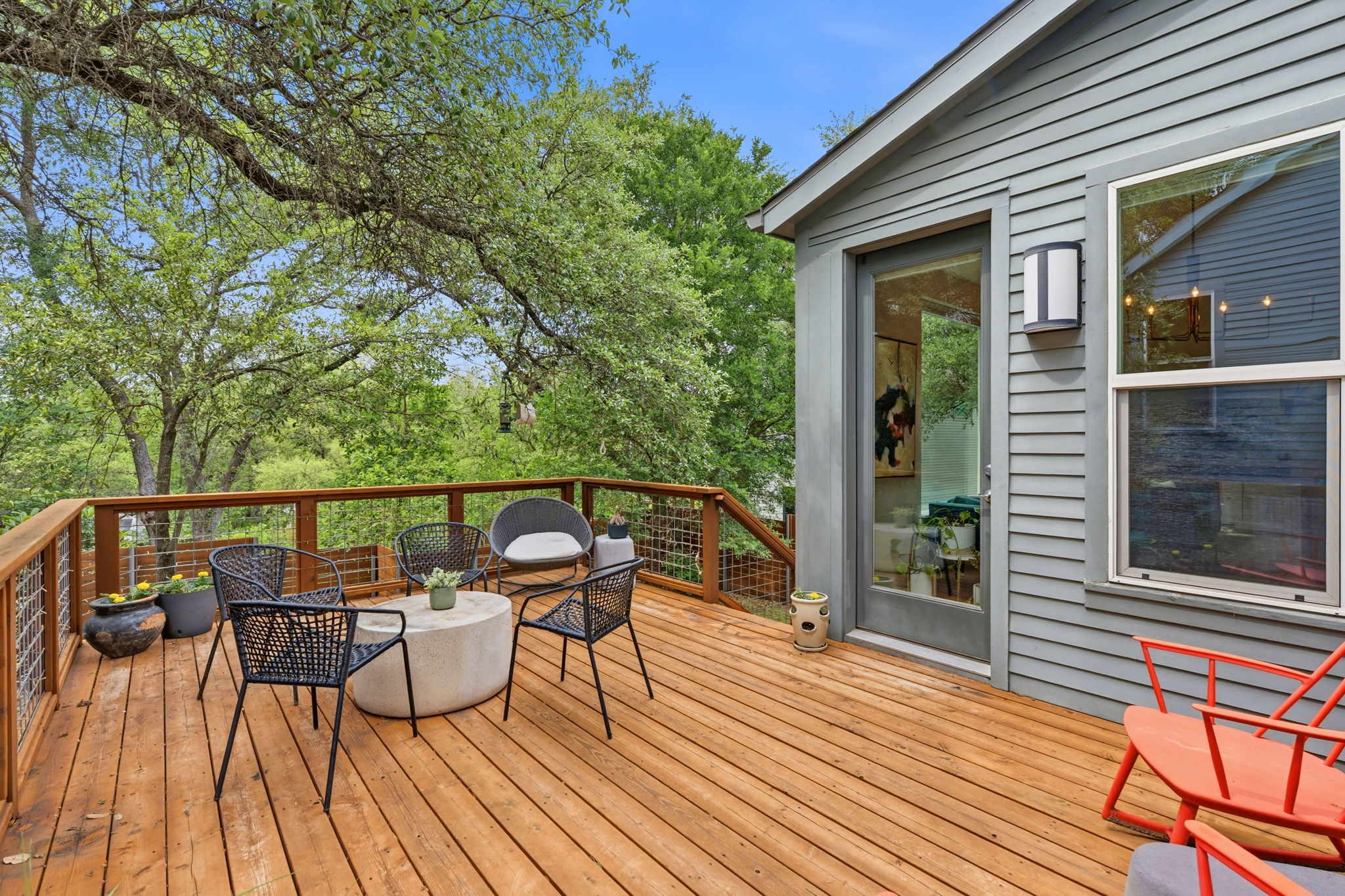 3001 Del Curto Road, Unit 31 Austin, TX 78704 - Photo 28 of 32 a balcony with wooden floor table and chairs