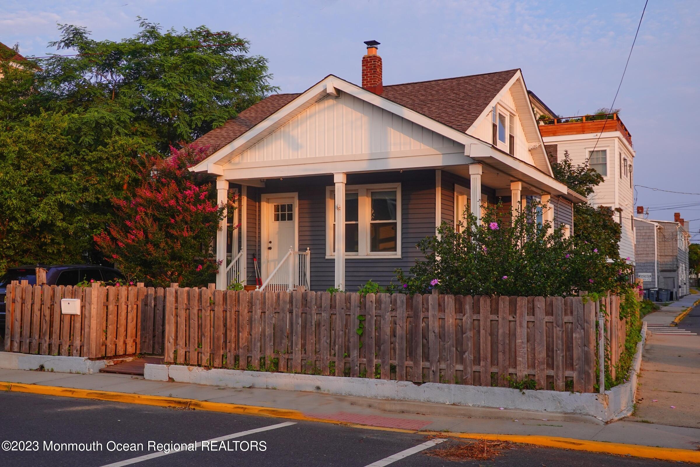 a front view of a house with a fence