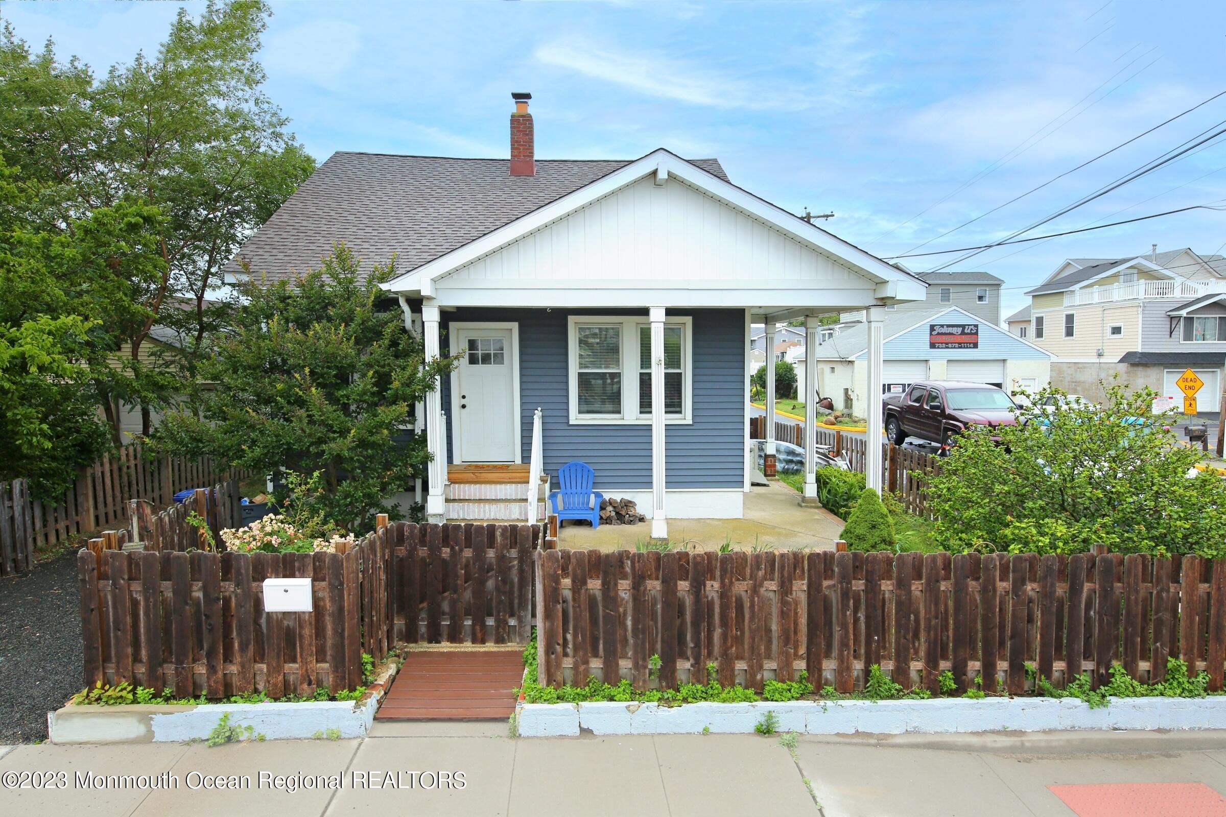 16 Cornwall Street Highlands, NJ 07732 - Photo 3 of 19 a front view of a house with a garden