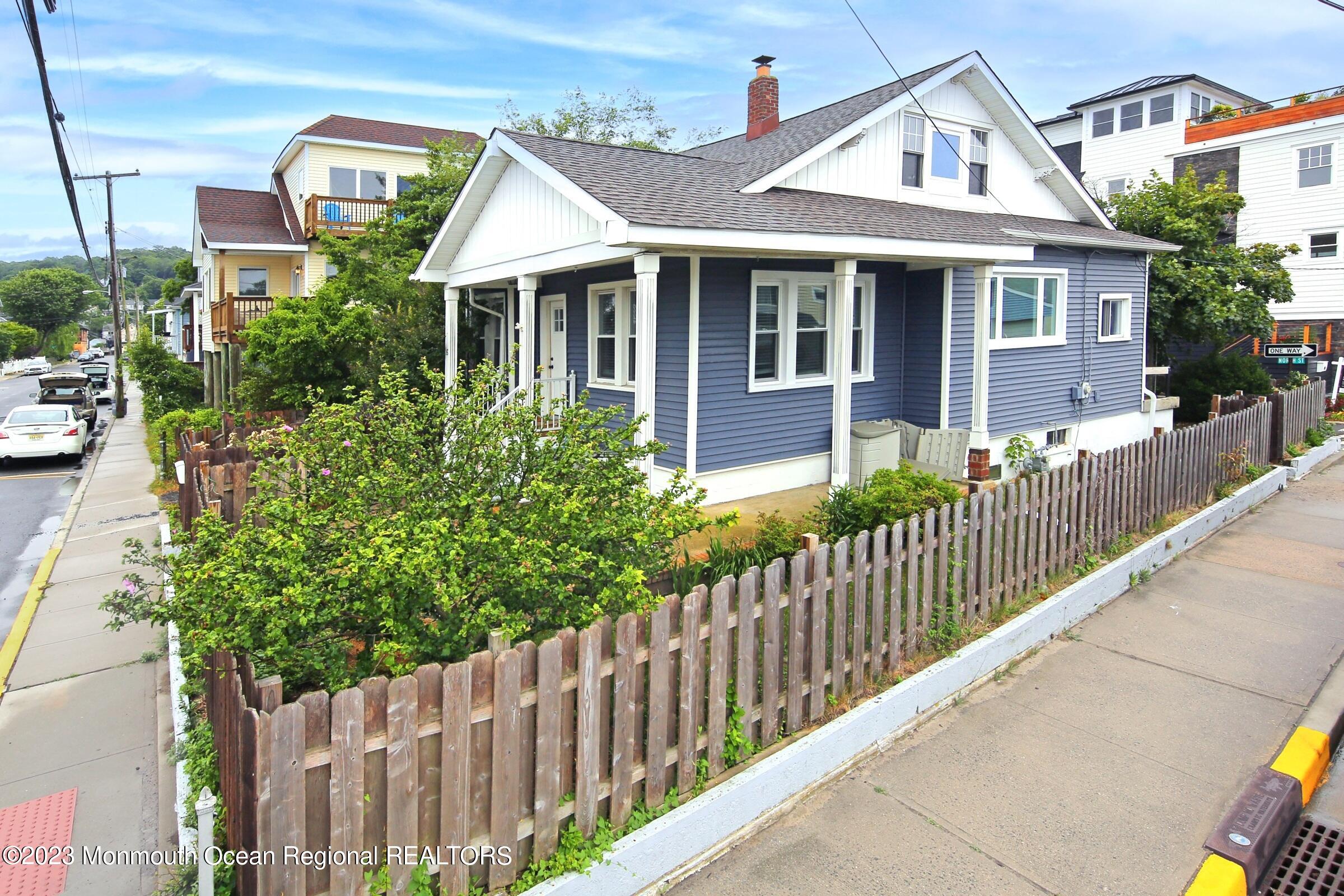 16 Cornwall Street Highlands, NJ 07732 - Photo 4 of 19 a front view of a house with a garden
