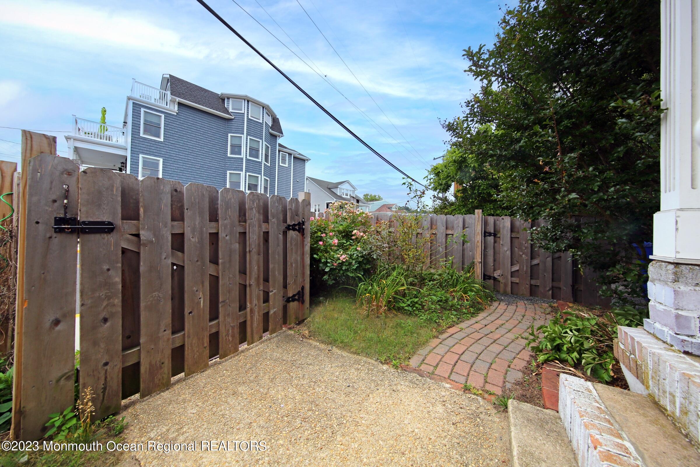16 Cornwall Street Highlands, NJ 07732 - Photo 7 of 19 a view of a house with wooden fence